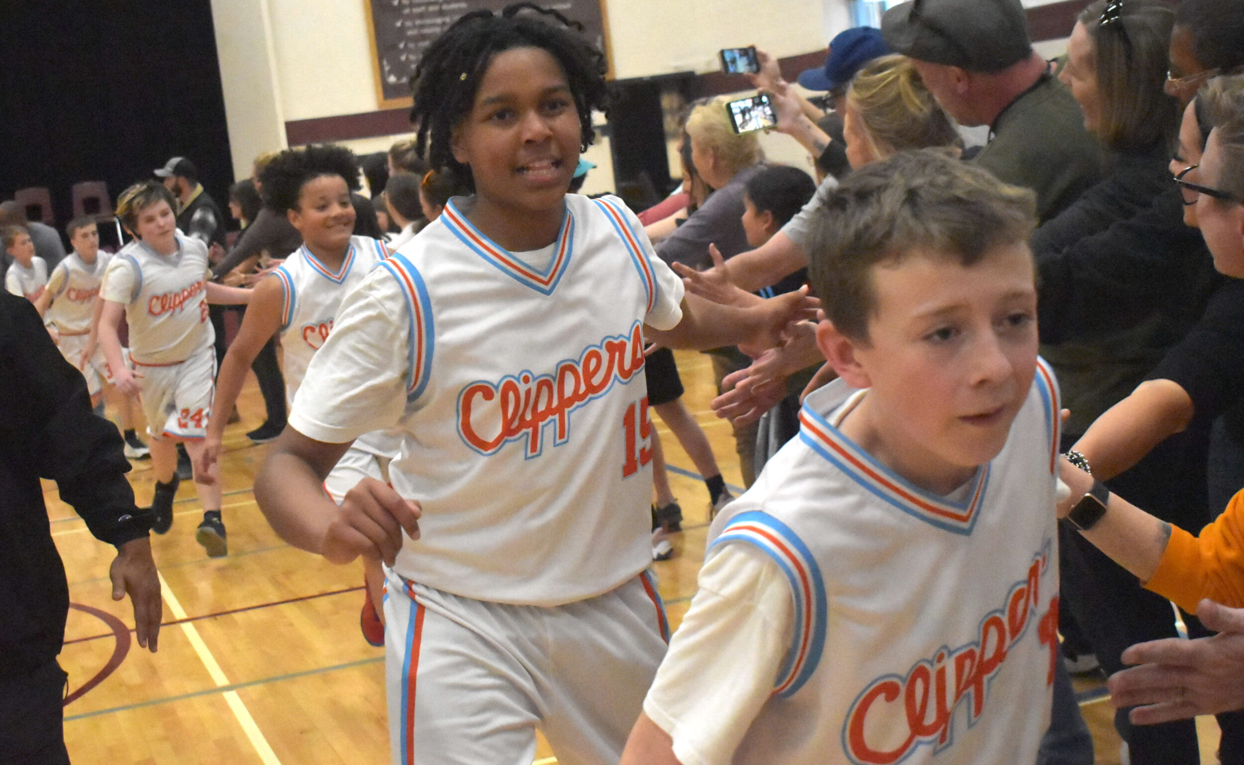 <p>Ben Carlone and King Merchant lead the way through the celebratory handshake line after winning the U13 2024 EOBA AA championship April 7. (Jason Parks/Gazette Staff)</p>
