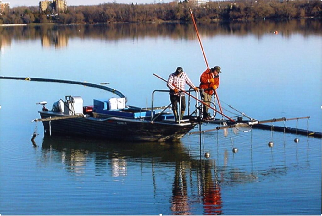 <p>John Rorabeck and a researcher use electrical probes to attract eels in the Ottawa River sometime in the 1990’s. (Photo supplied by John Rorabeck)</p>
