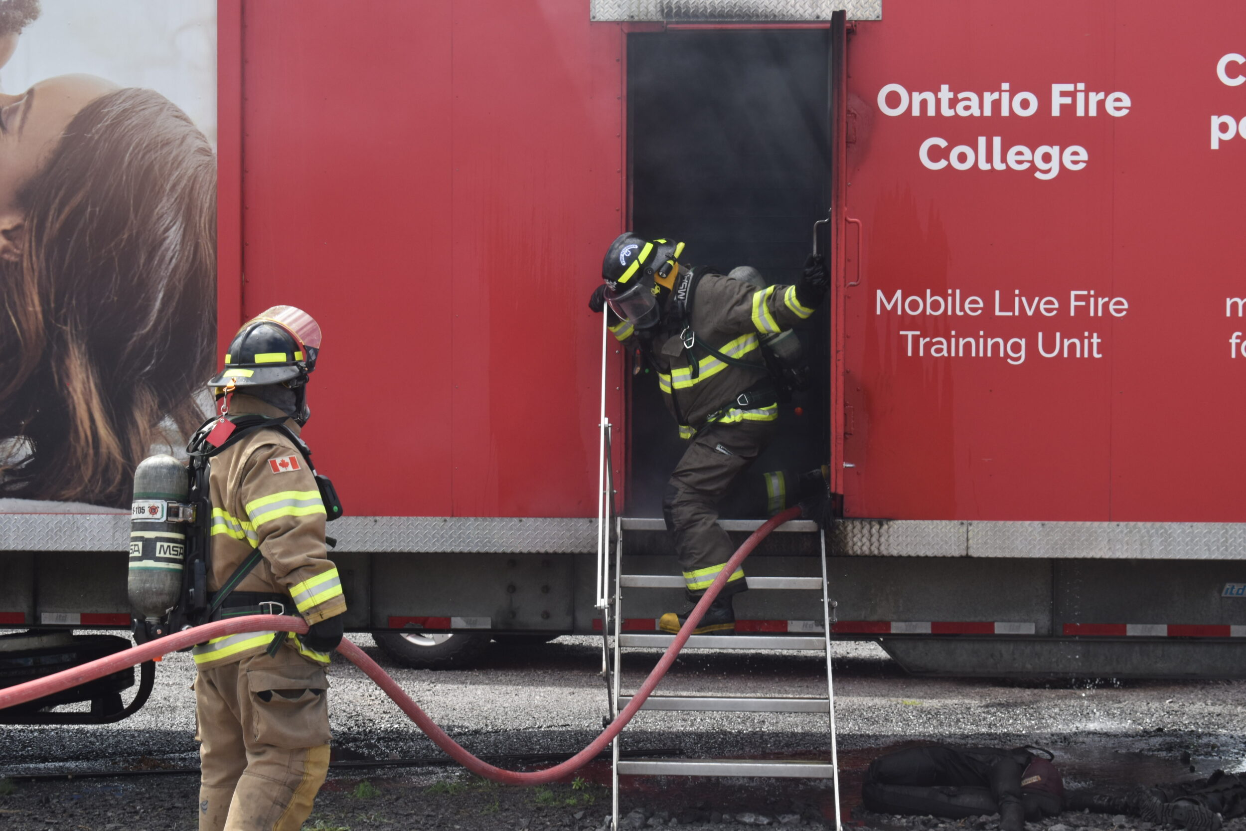 <p>Local firefighters prepare to enter the Ontario Fire College’s training truck. (Jason Parks/Gazette Staff)</p>
