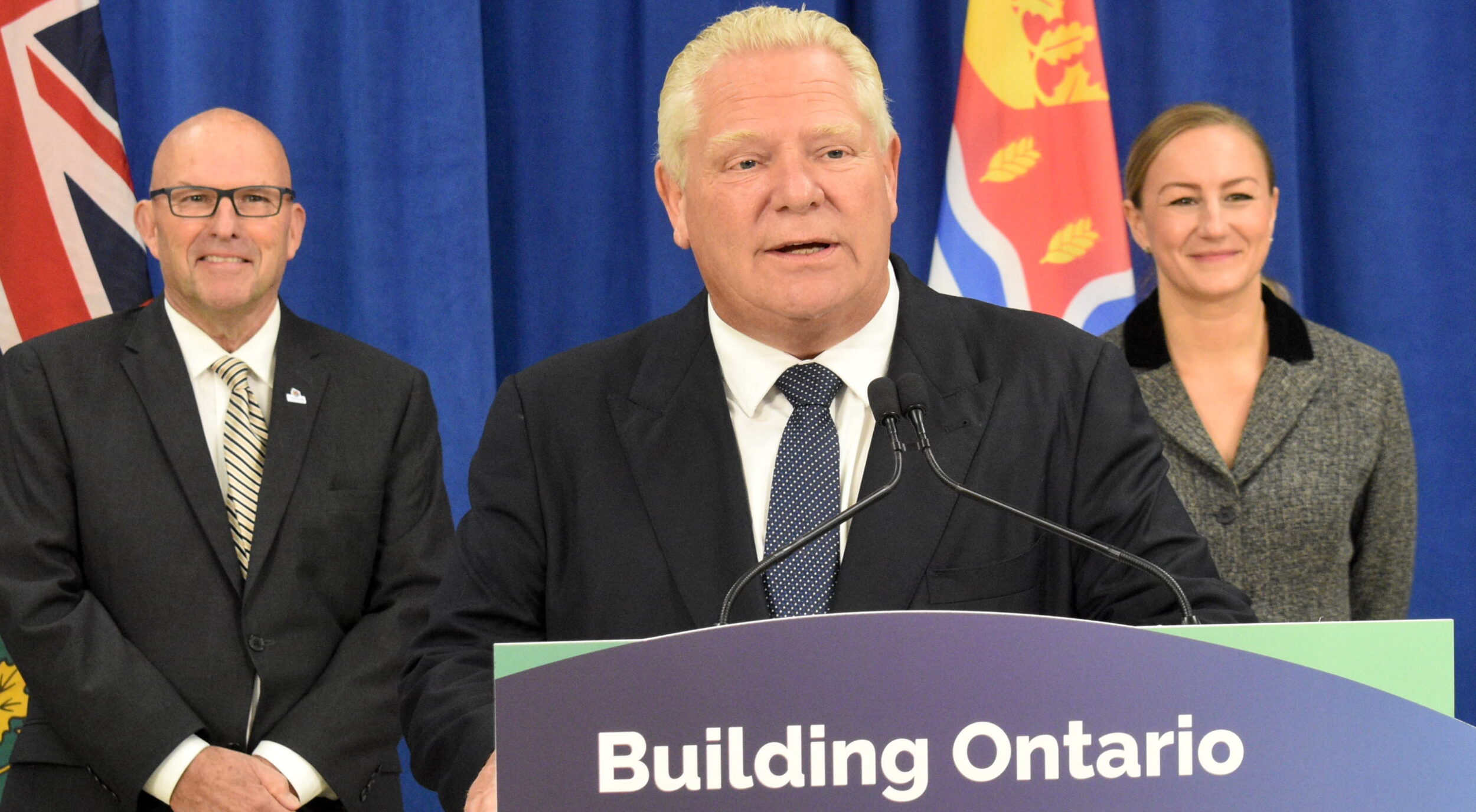 <p>Mayor Steve Ferguson and Infrastructure Minister Kinga Surma flank Premier Doug Ford at Highline Hall Monday Morning. The Ontario Government is investing $18.3 million in the Regional Water Treatment Plant which will service over 4,000 new homes in Prince Edward County by 2032. (Jason Parks/Gazette Staff)</p>
