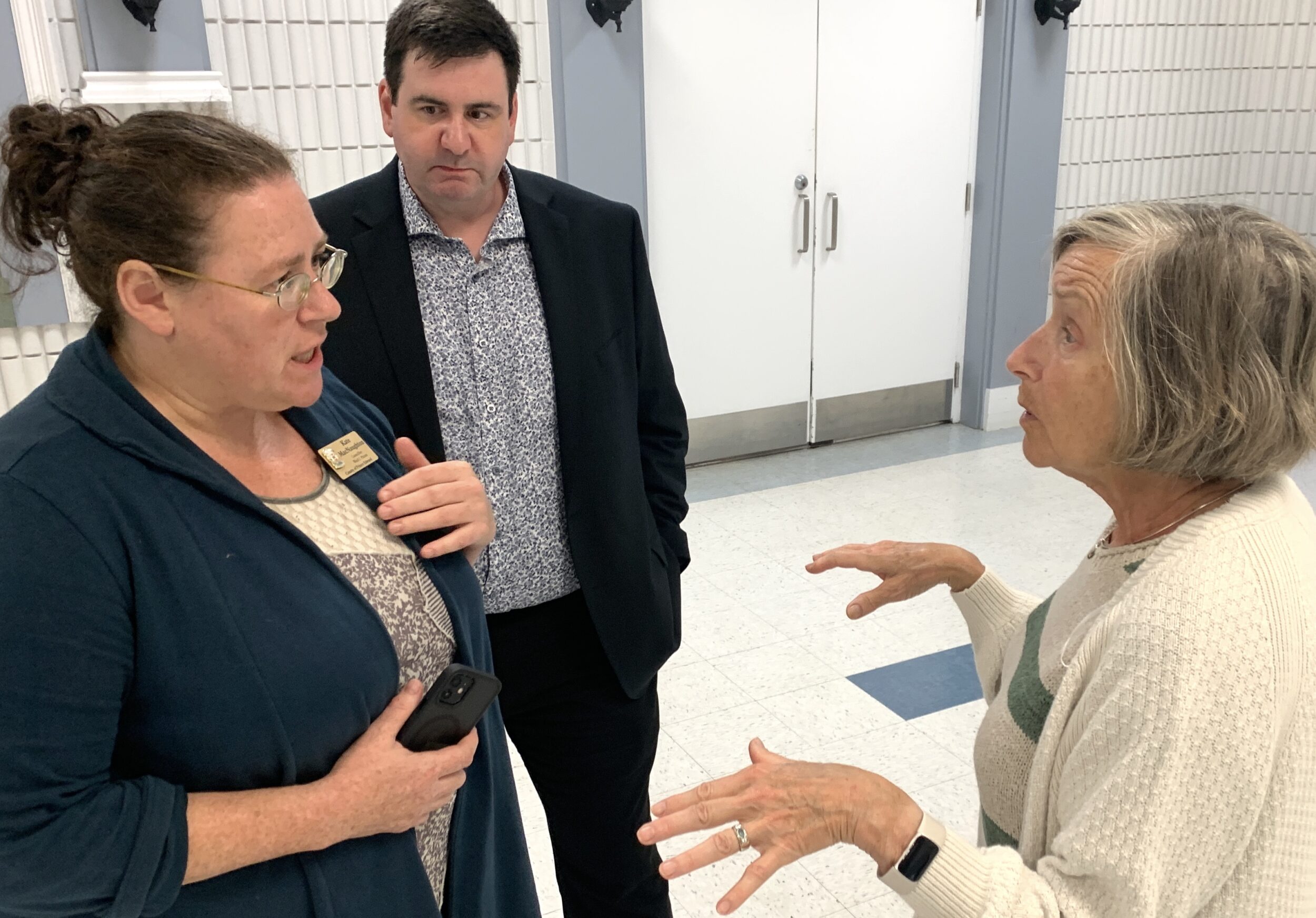 <p>Councillor Kate MacNaughton and Director of Housing Adam Goheen listen to a local resident on the subject of turning the former Queen Elizabeth school into a community hub and housing. (Jason Parks/Gazette Staff)</p>
