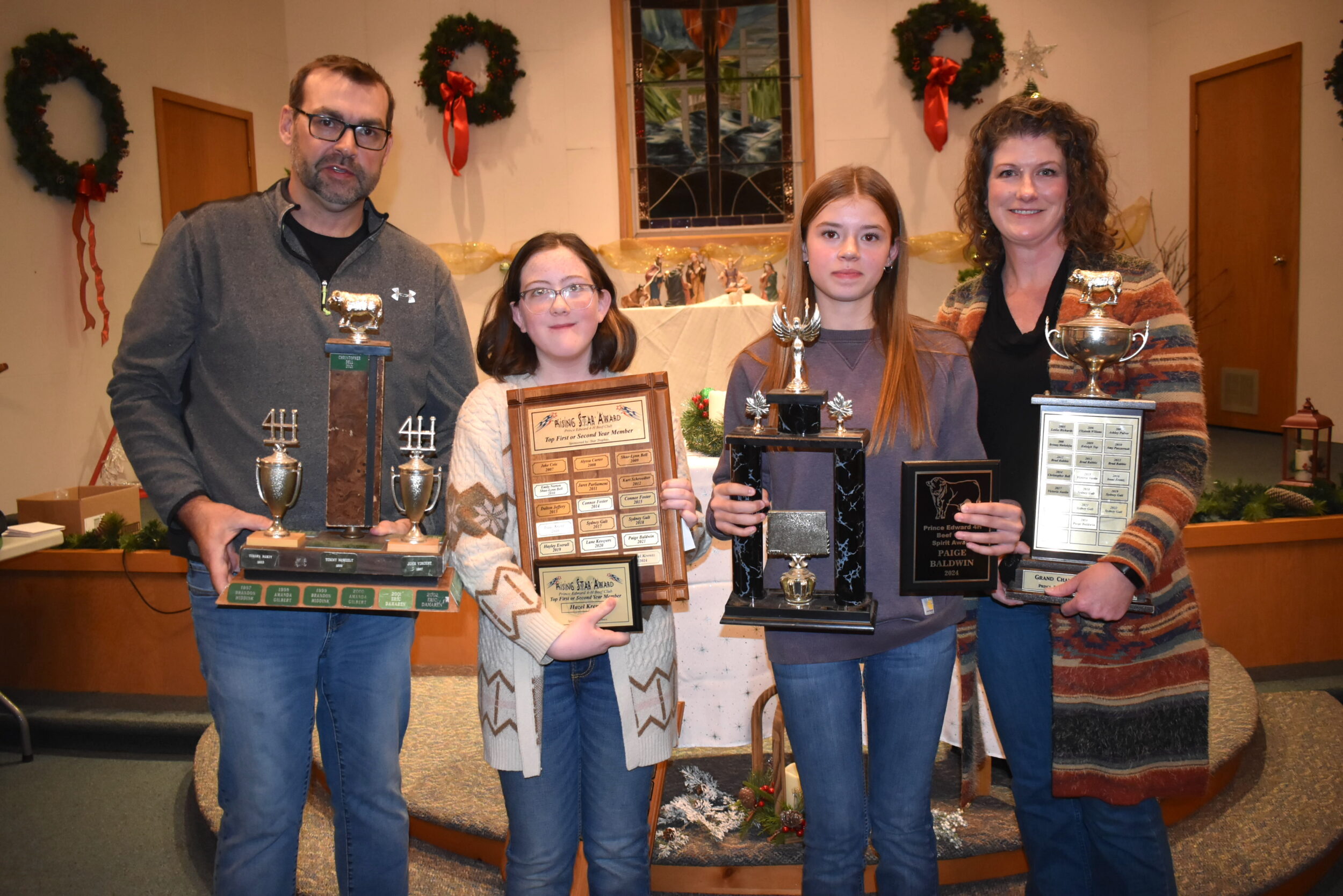 <p>Club Leaders Barry Baldwin and Sara Beth Hopkins present (Second from left) Hazel Krentz and Paige Baldwin with their individual club awards. (Jason Parks/Gazette Staff) </p>
