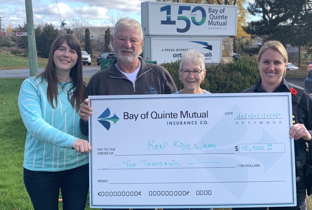 <p>Bay of Quinte Mutual Insurance Board members (from left) Chrissy Poitras and Art Wiersma present a cheque for $10,000 to support the Keep Kids Warm Campaign to organizer Barb Sills and Community Services Officer Constable Nicole Cordingley. (Jason Parks/ Gazette Staff)</p>
