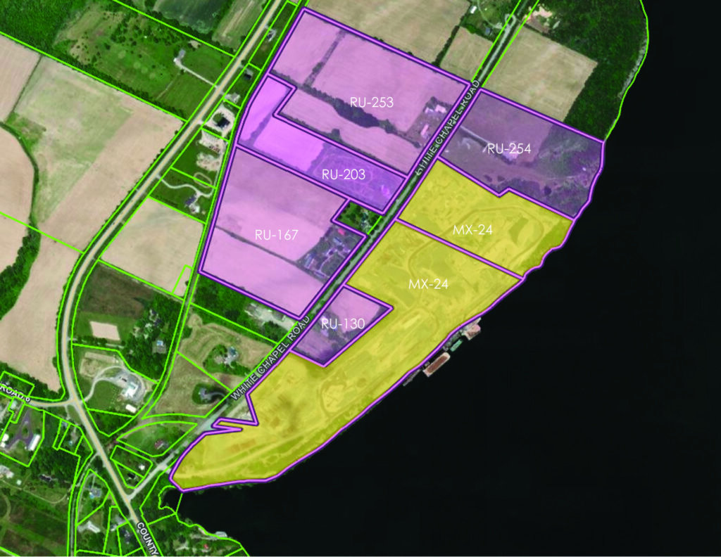 <p>In addition to land holdings at 24, 130, 167, and 203 White Chapel Road, two additional properties, 254 and 253 White Chapel Road are proposed as “expansion lands,” to be included in the Ministerial Zoning Order. Picton Terminals is more than doubling in size. An MZO would apply to all of the pictured properties and parcels. (Image courtesy of the County’s GIS). Picton Terminals consists of two adjacent parcels, the first, about 75% of the property, is zoned Extractive Industrial (MX). The second is zoned Rural (RU1). The lands it has been working to acquire over the past decade are also zoned RU, or rural. All of the surrounding land is farmland and Picton Terminals’ expansion plans involve the destruction of a number of historic farmhouses and barns.</p>

