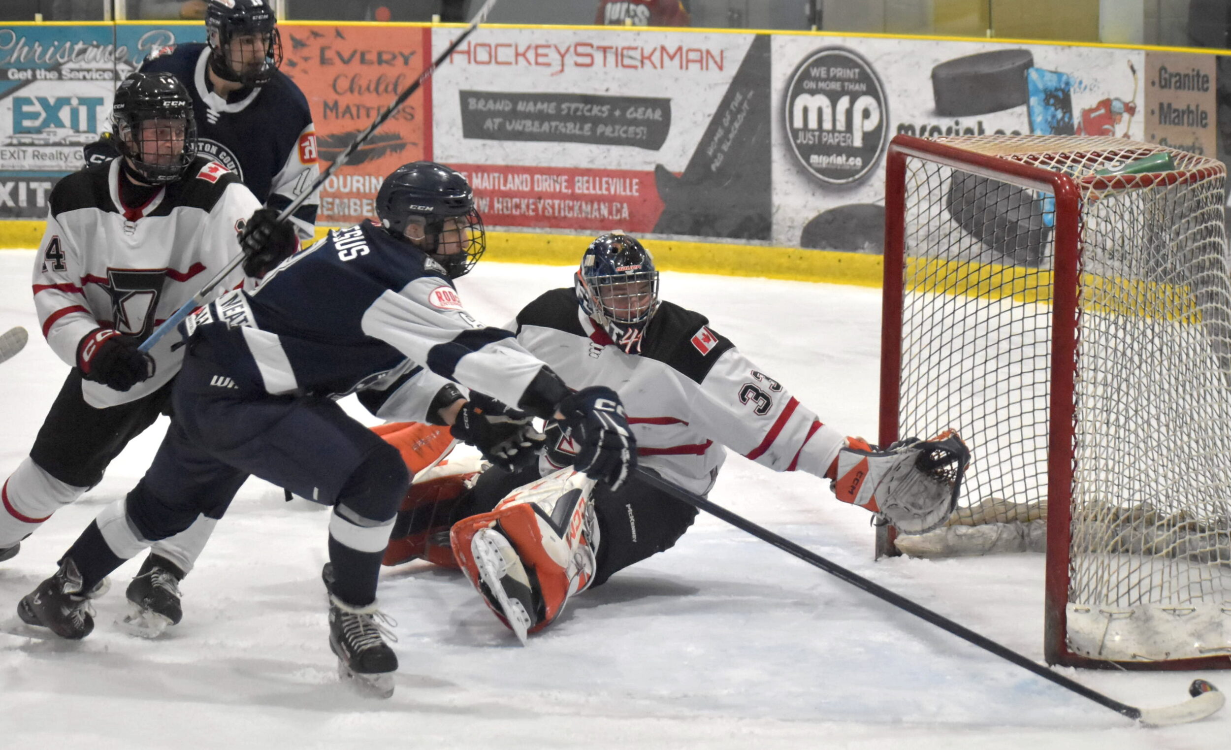 <p>Haliburton’s Deandres De Jesus tries to corral a loose puck as Wellington goaltender Jacob Borwn sprawls to make a save in the Huskies 4-0 win over the Dukes Tuesday evening. (Jason Parks/Gazette Staff)</p>

