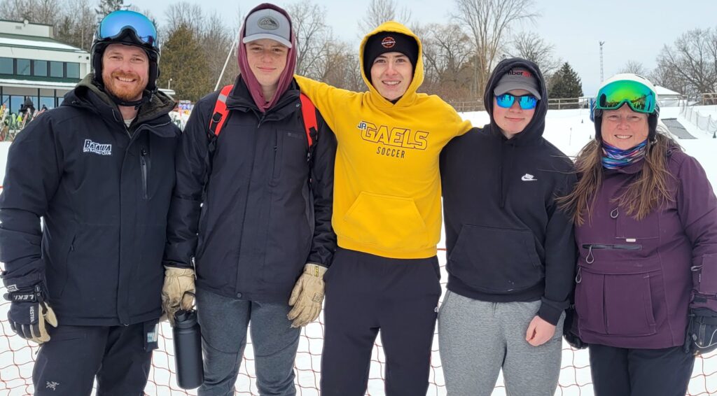 <p>Flanked by coaches Aaron Gray and Jocelyn Buggie are PECI Alpine team members Carson Camp, Josh McGill and Kallen Vancott. (Submitted Photo) </p>

