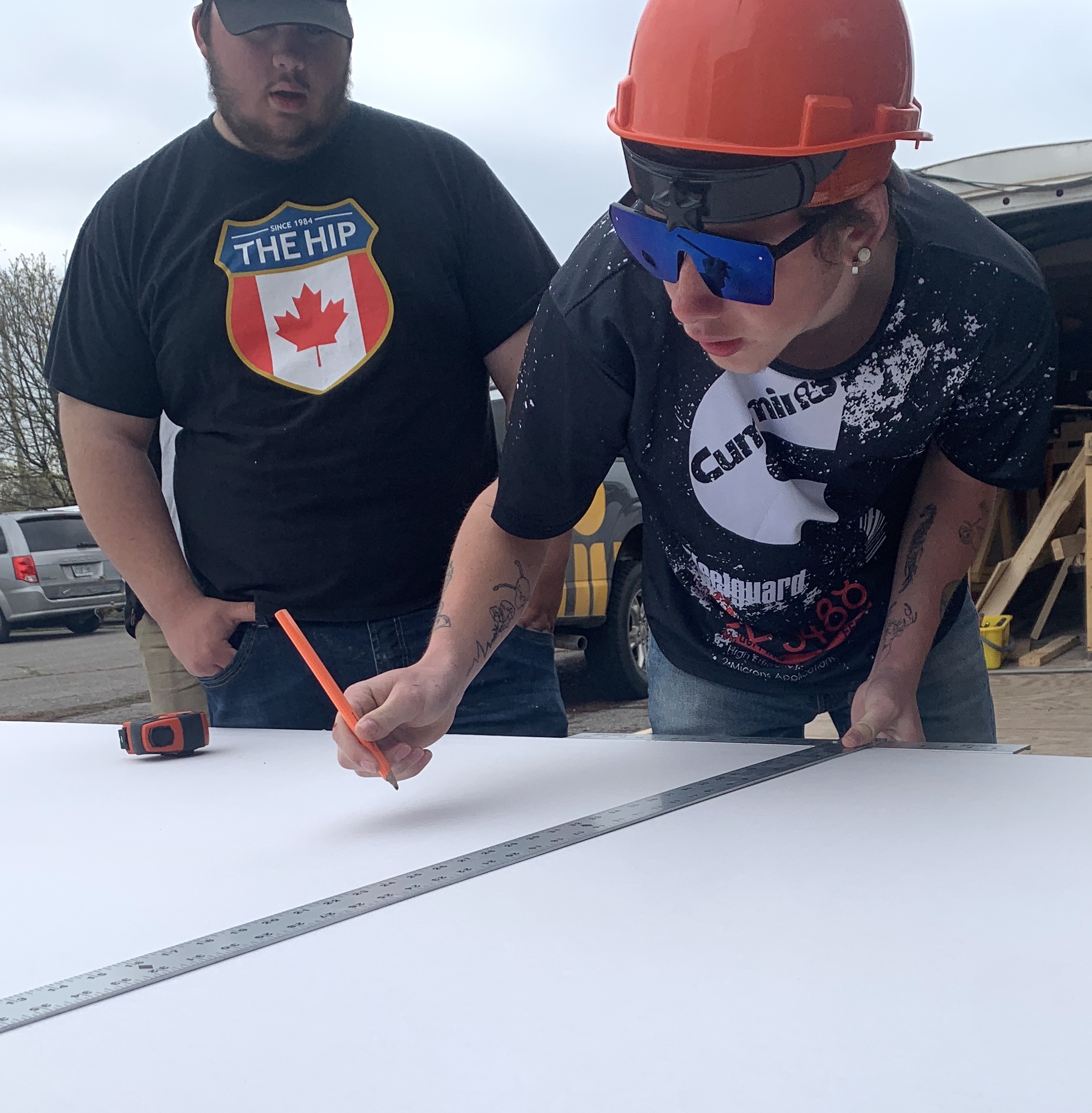 <p>PELC Students James Parks and Seth Murphy measure drywall at Pinecrest Housing last week. (Jason Parks/Gazette Staff)</p>
