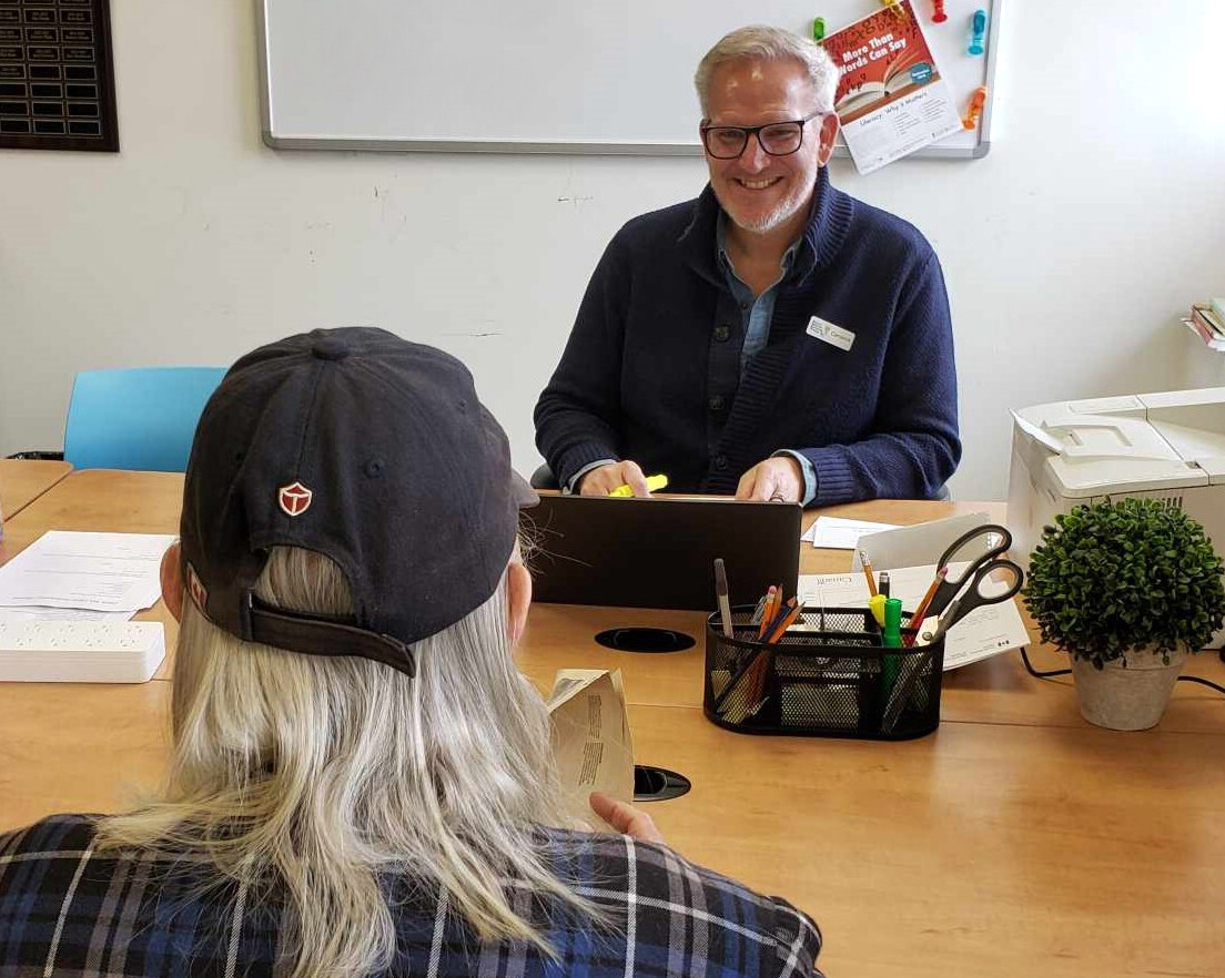 <p>PELC Board member Cameron Bedford helps a local resident file their taxes. (Supplied Photo)</p>
