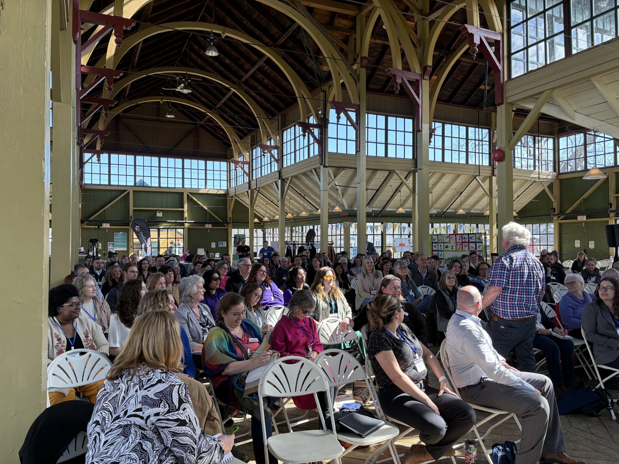 <p>Peter Kenyon addresses the Teeny Tiny Summit at Crystal Palace (Photo: Karen Valihora / Gazette Staff)</p>
