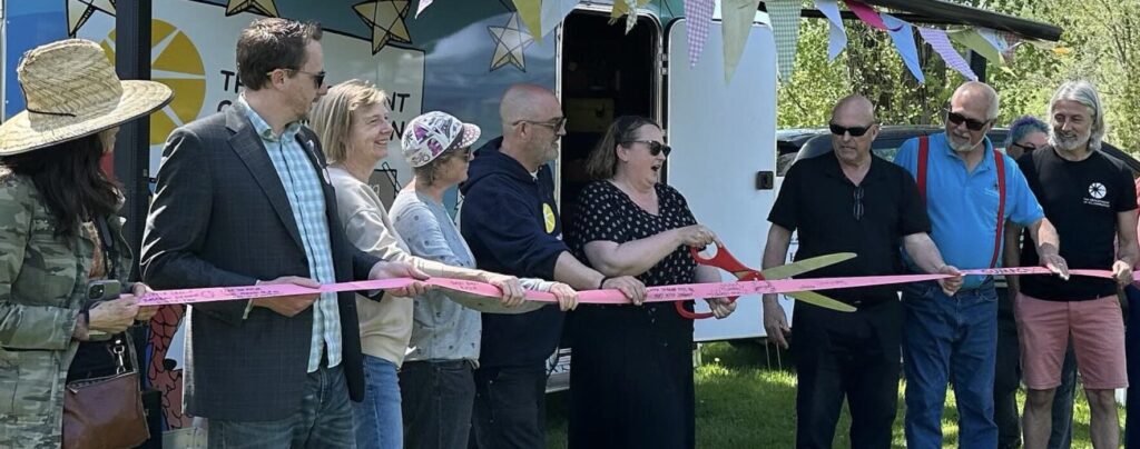 <p>(Centre) The Department of Illumination’s Krista Dalby cuts the ribbon on the official opening of a public art residency project taking place at Delhi Park this summer. (Supplied Photo)</p>

