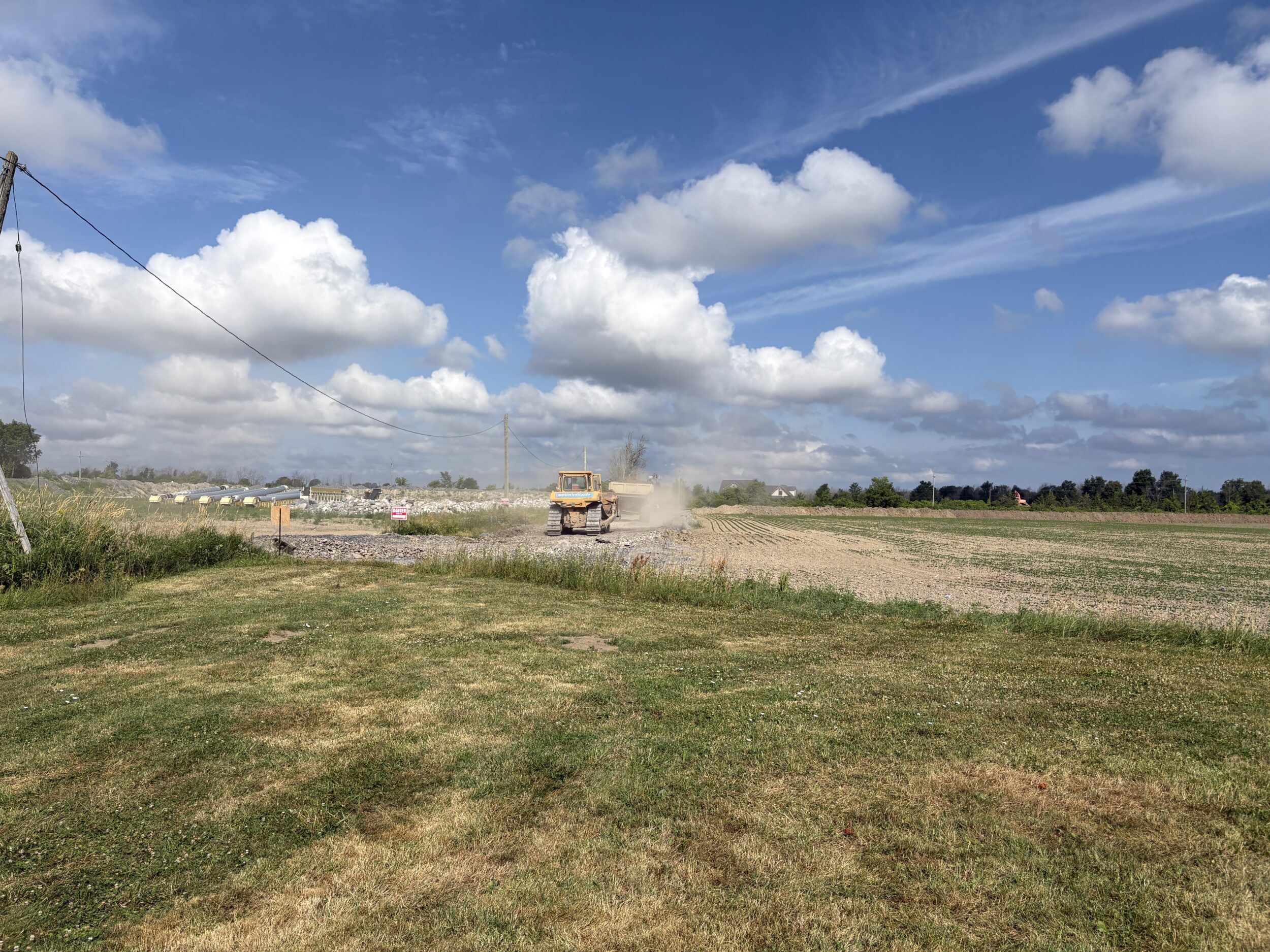<p>Former wheat fields north of White Chapel Road have a stockpile of chutes for tumbling aggregate.</p>

