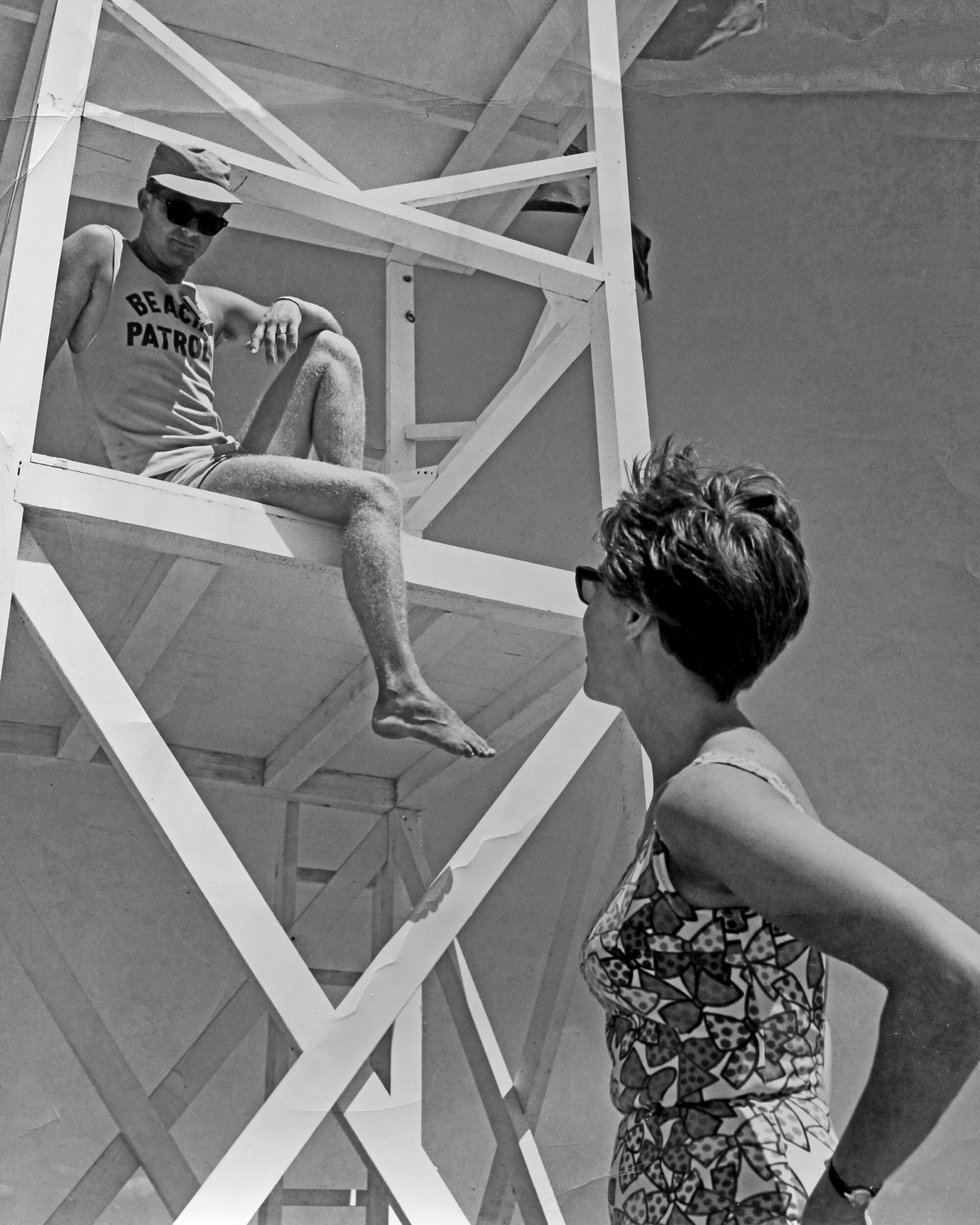 <p>North Beach Beach Patrol member Vic Alyea speaks with a swimmer sometime in the late 1960s. (Supplied Photo)</p>
