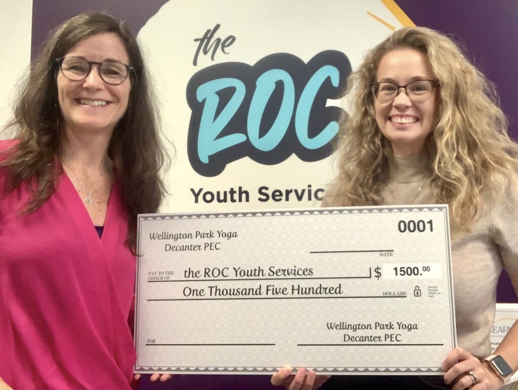 <p>Yoga teacher MJ Macdonald presents a cheque worth $1,500 to theROC Youth Services Executive Director Shannon Collins. (Supplied Photo)</p>
