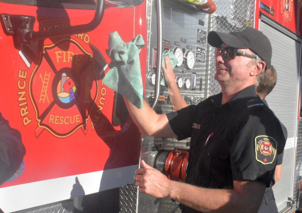 <p>Firefighter Matt Stiff puts the shine on Prince Edward County Fire & Rescue’s new pumper truck.(Jason Parks/Gazette Staff)</p>
