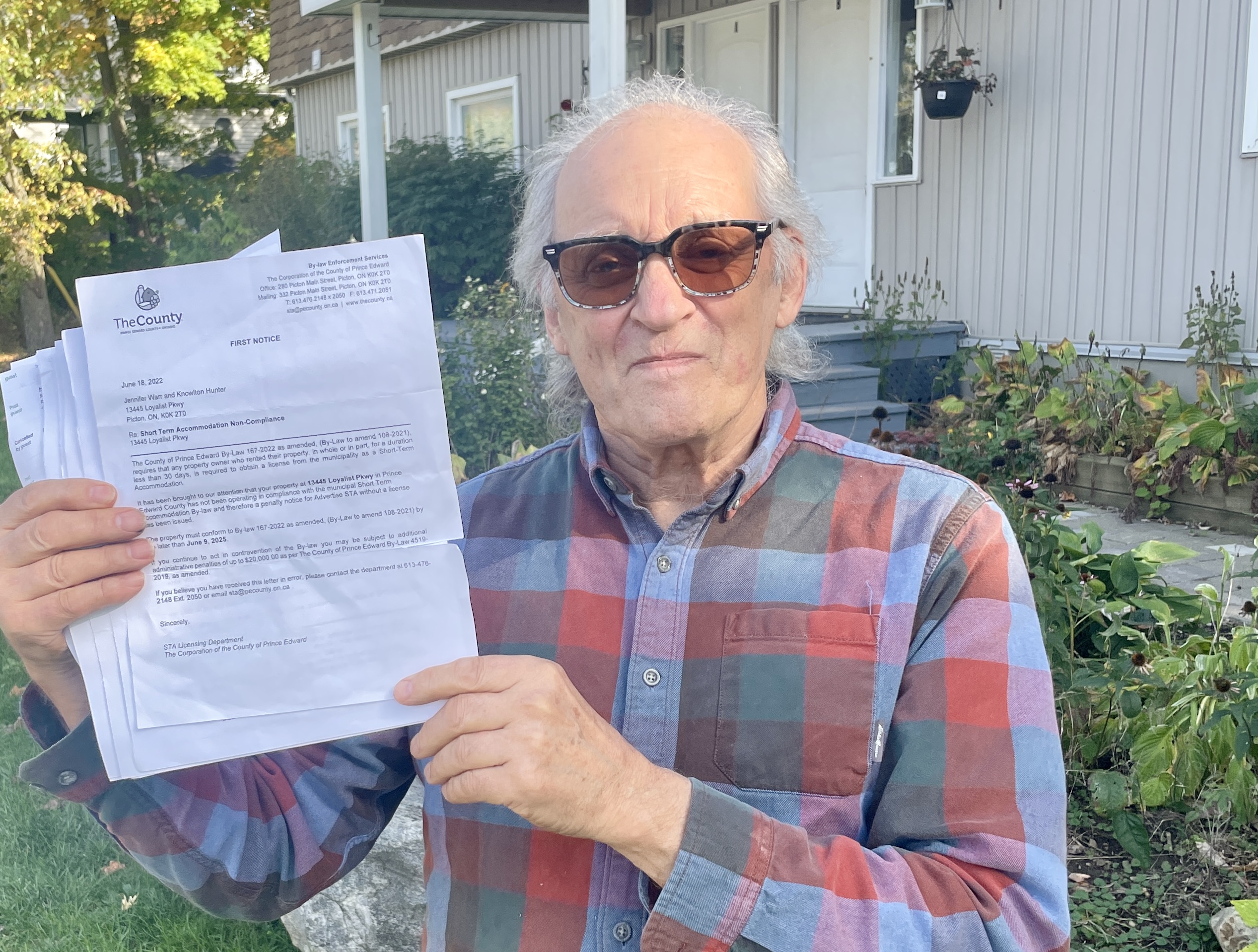 <p>Knowlton Hunter with correspondence from Prince Edward County’s Bylaw department. (Jason Parks/Gazette Staff)</p>
