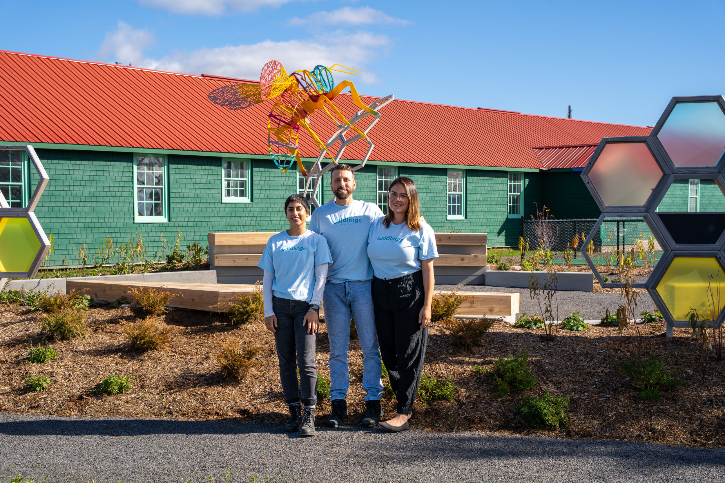 <p>Mishaal Taylor, Callum Bramley, and Sarah Georges in front of Building 3 at Base31. (Logan Somers/Photo.)</p>
