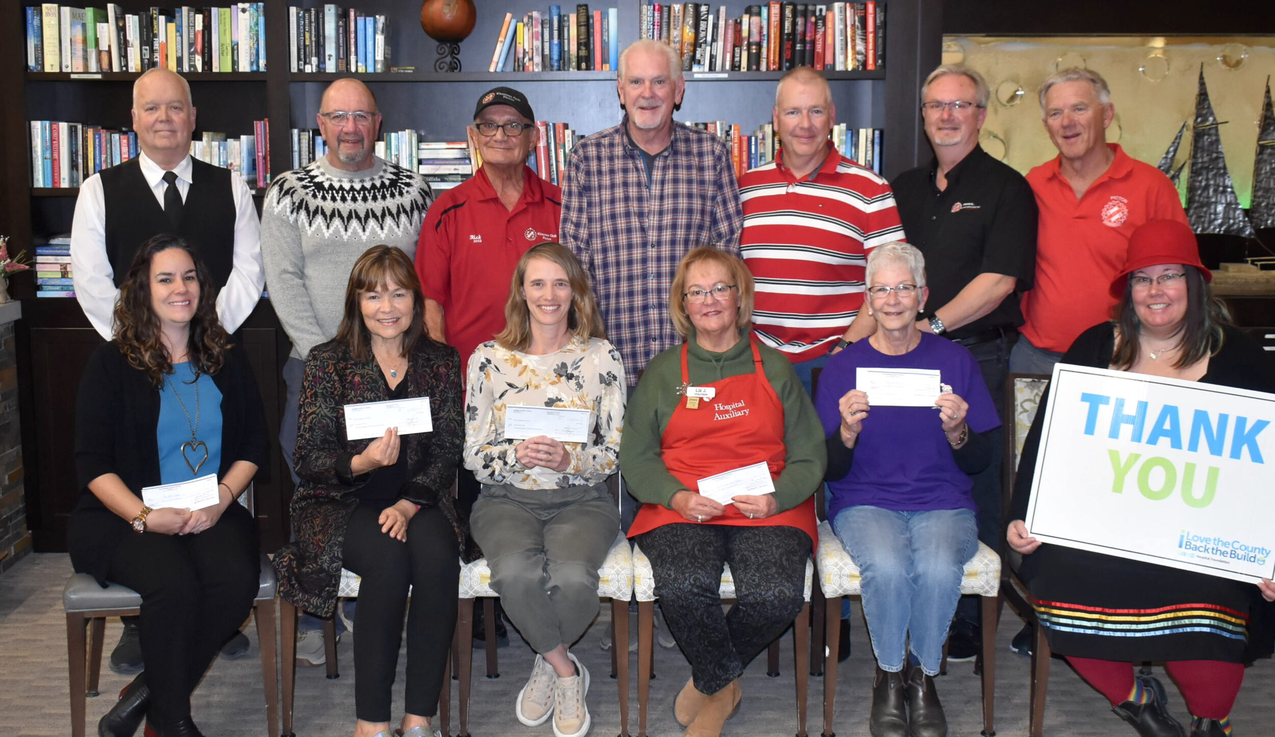 <p>On hand to accept cheques were (Front Row, L-R) Natalie Wright of Hospice Prince Edward, Lynne Donovan of The Andrew, Andrea Dawes of County Kids Read, Liz Jones of Festival of Trees, Barb Sills of Adopt-a-Child Snowsuit Program and Briar Boyce of the Prince Edward County Memorial Hospital Foundation. Pictured at top are Mr. Rea, Kinsman Ray Prevost, Club President Rick Caruso, Don Muzzerall, Mark Heubner, Brent Timm and Terry DeRoche. (Jason Parks/Gazette Staff)</p>
