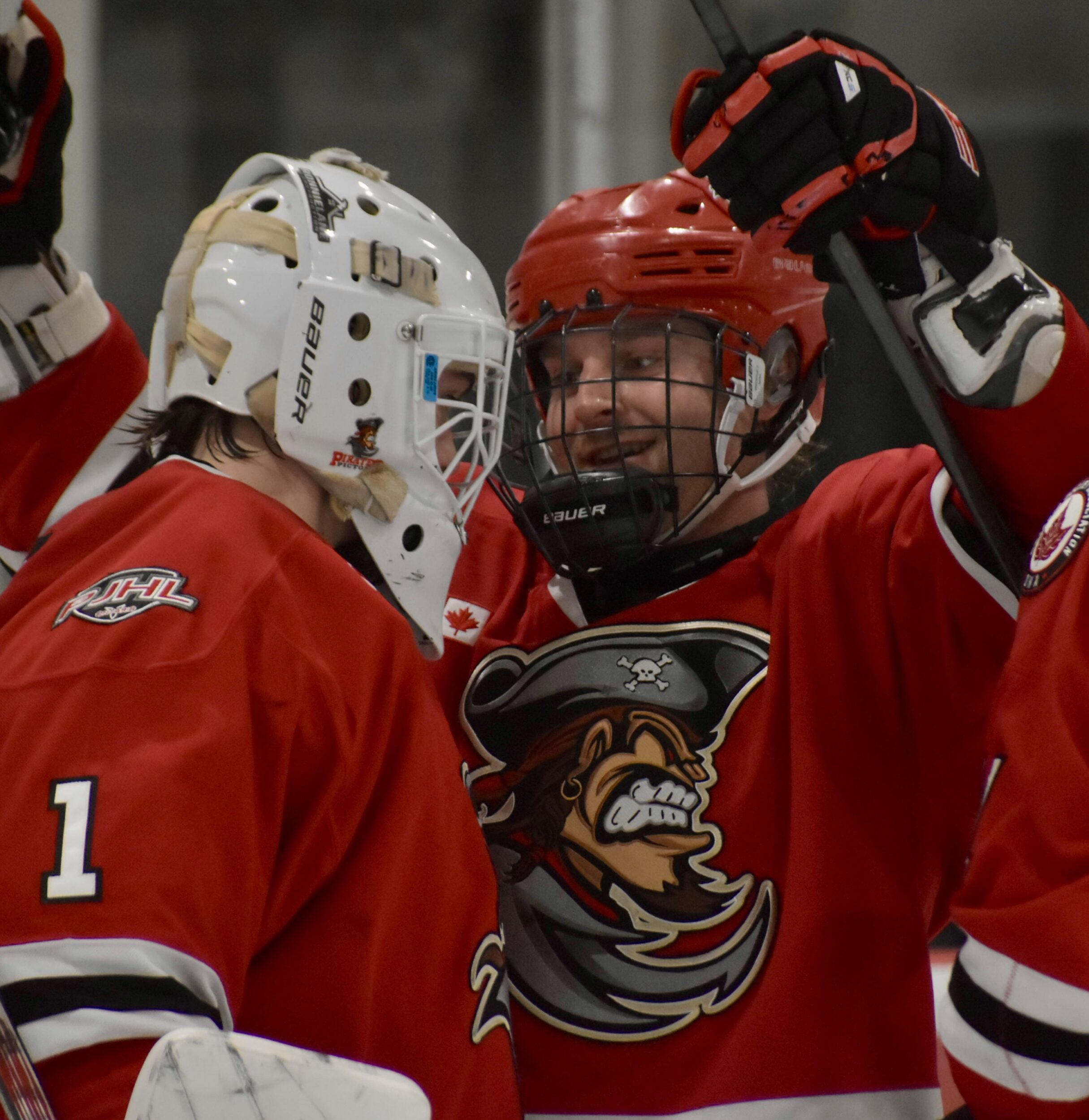<p>Picton defender Nate Woods congratulate’s rookie goaltender Nick Parodo after the club’s 4-0 win over visiting Port Hope Thursday night. (Jason Parks/Gazette Staff)</p>
