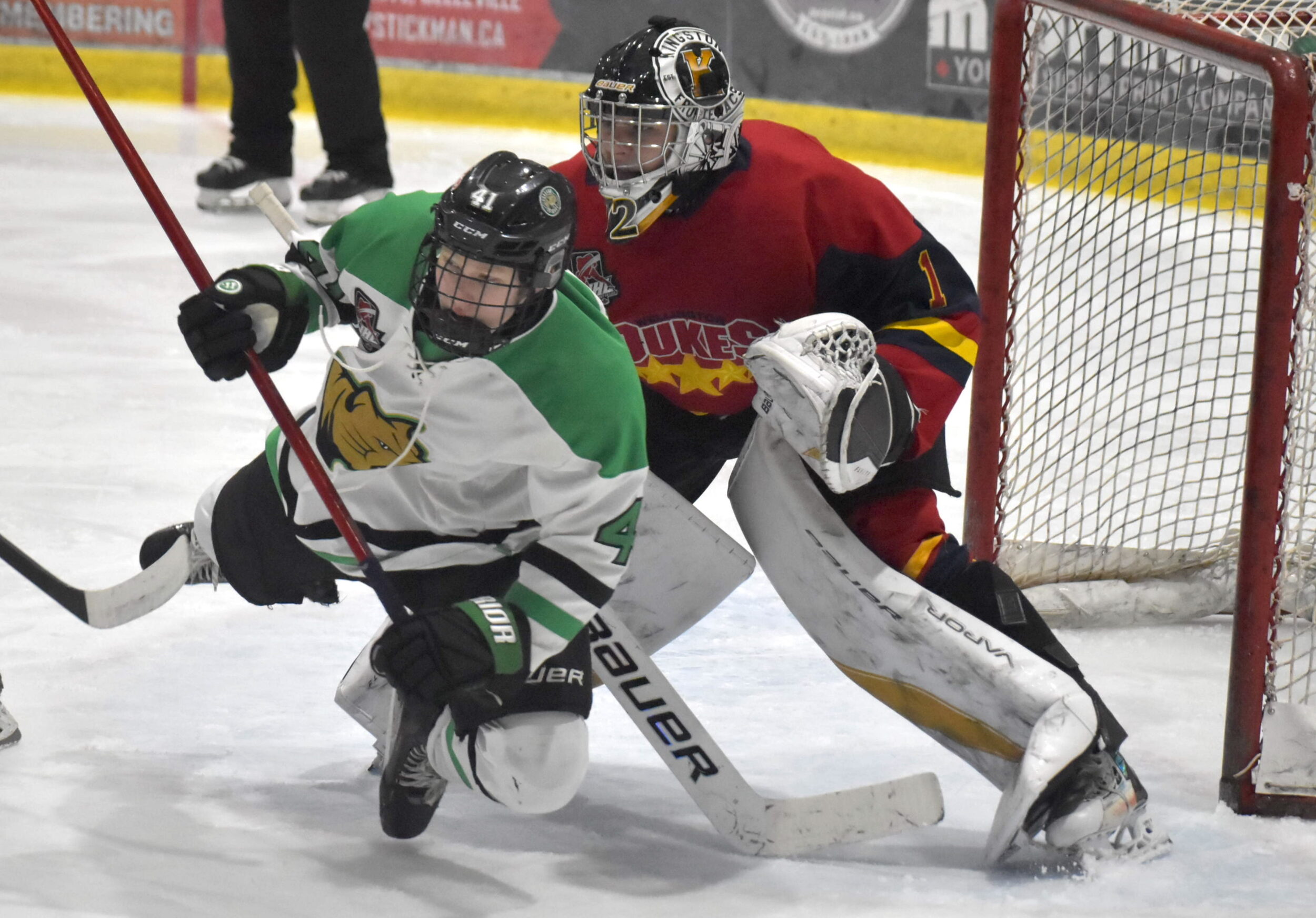 <p>Cobourg’s Egor Kozlov crashes goaltender Royden Smith’s crease during Wellington’s 8-5 win Sunday afternoon. (Jason Parks/Gazette Staff)</p>
