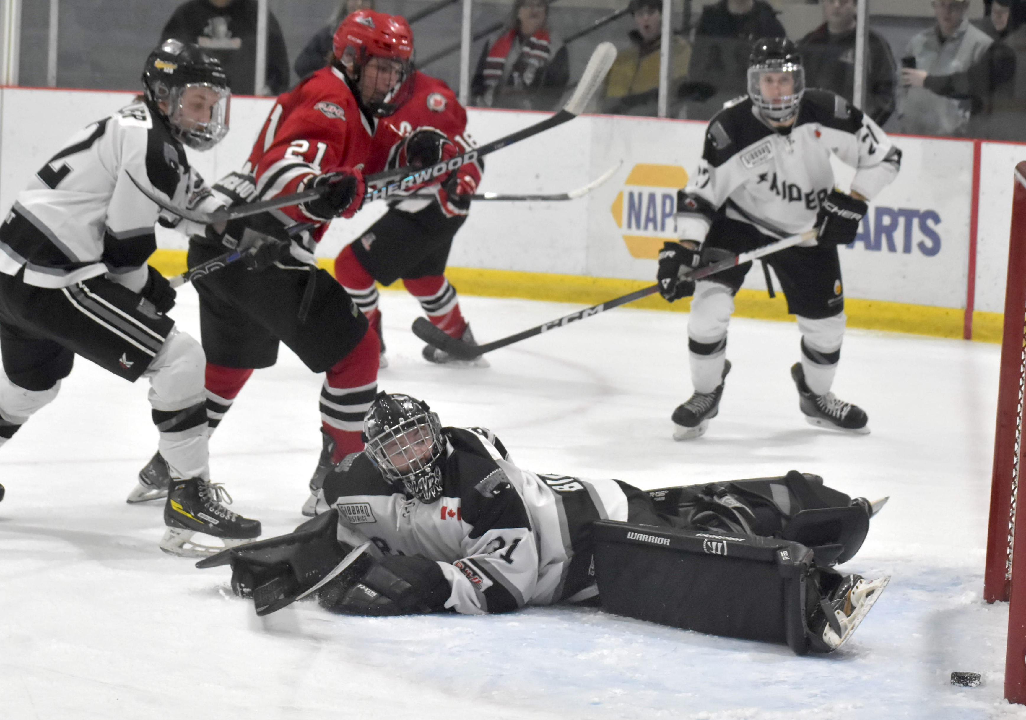 <p>Picton&#8217;s Luc Amat slides the puck past Napanee&#8217;s Denholm Blair Thursday night for the eventual game winning goal in a 3-1 win. (Jason Parks/Gazette Staff)</p>
