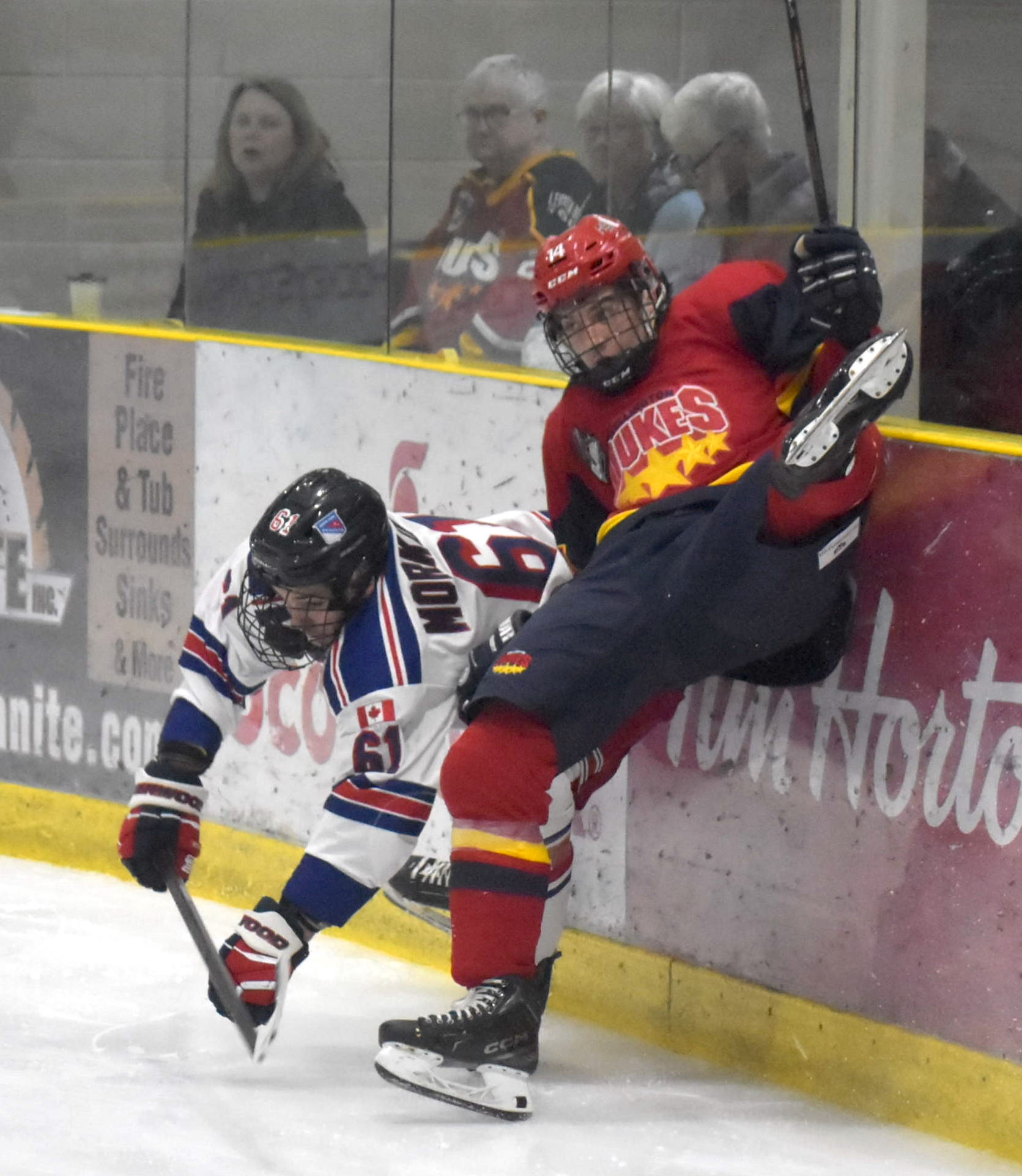 <p>North York&#8217;s Carson Morkotinis and Wellington&#8217;s Sammy Longo mix it up in the corner. (Jason Parks/Gazette Staff)</p>
