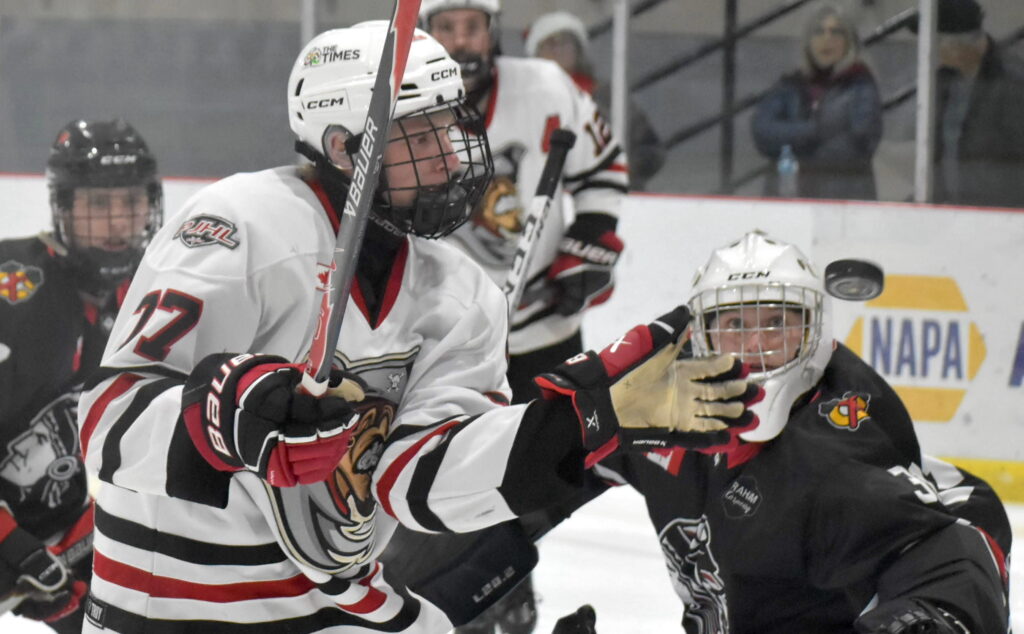 <p>Picton’s Wesley Jackson and Lakefield’s Braeden Derks keep close watch on the puck Thursday night. (Jason Parks/Gazette Staff)</p>
