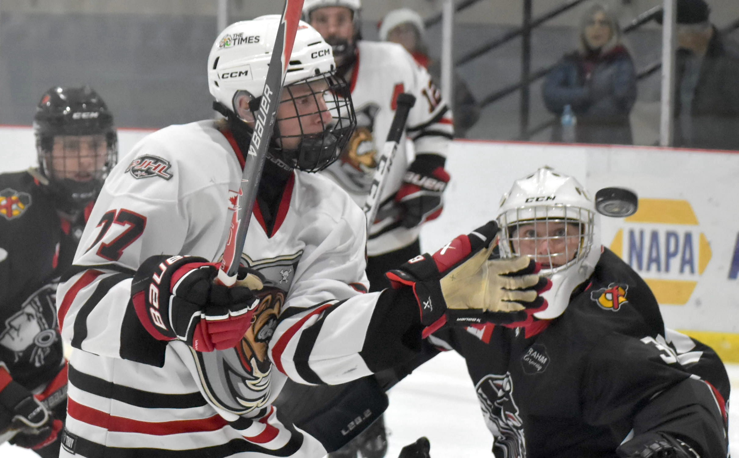 <p>Picton&#8217;s Wesley Jackson and Lakefield&#8217;s Braeden Derks keep close watch on the puck Thursday night. (Jason Parks/Gazette Staff)</p>
