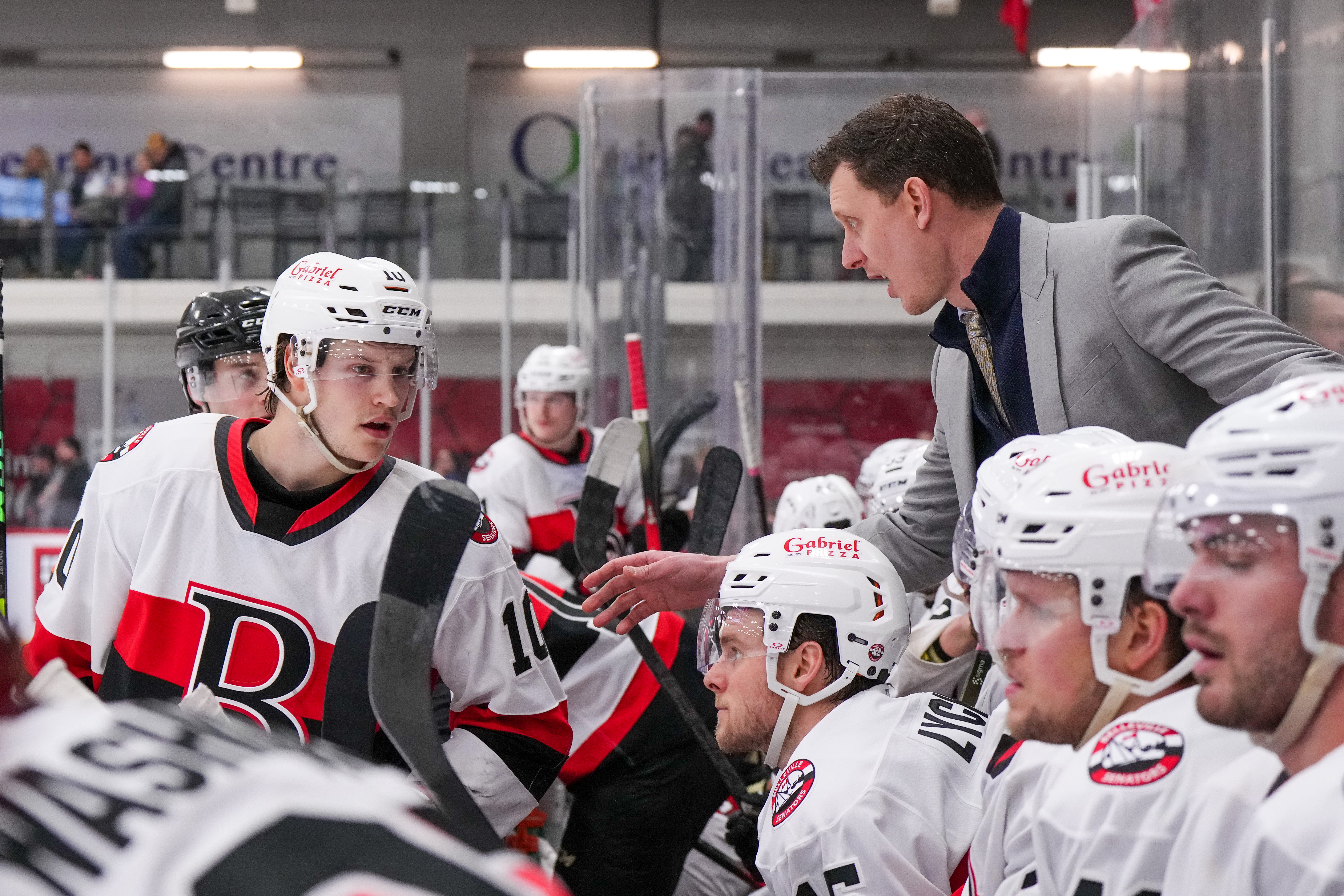 <p>Belleville Senators Interim Head Coach Andrew Campbell emphasizes a point to Philip Daoust during a game against the Syracuse Crunch. (Belleville Senators/Jana Chytilova/Freestyle Photography)</p>
