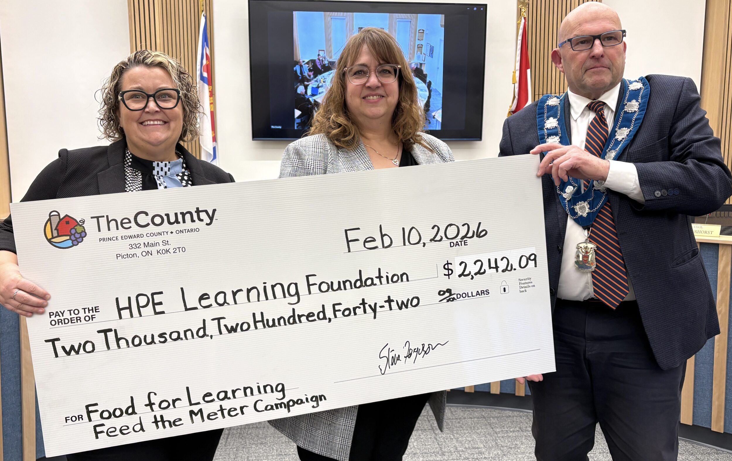 <p>From left: Jenn Barrett and Kellie Brace of the Hastings Prince Edward Learning Foundation accept the 2025-26 Feed the Meter donation from Mayor Steve Ferguson. (Karen Valihora/Gazette Staff)</p>
