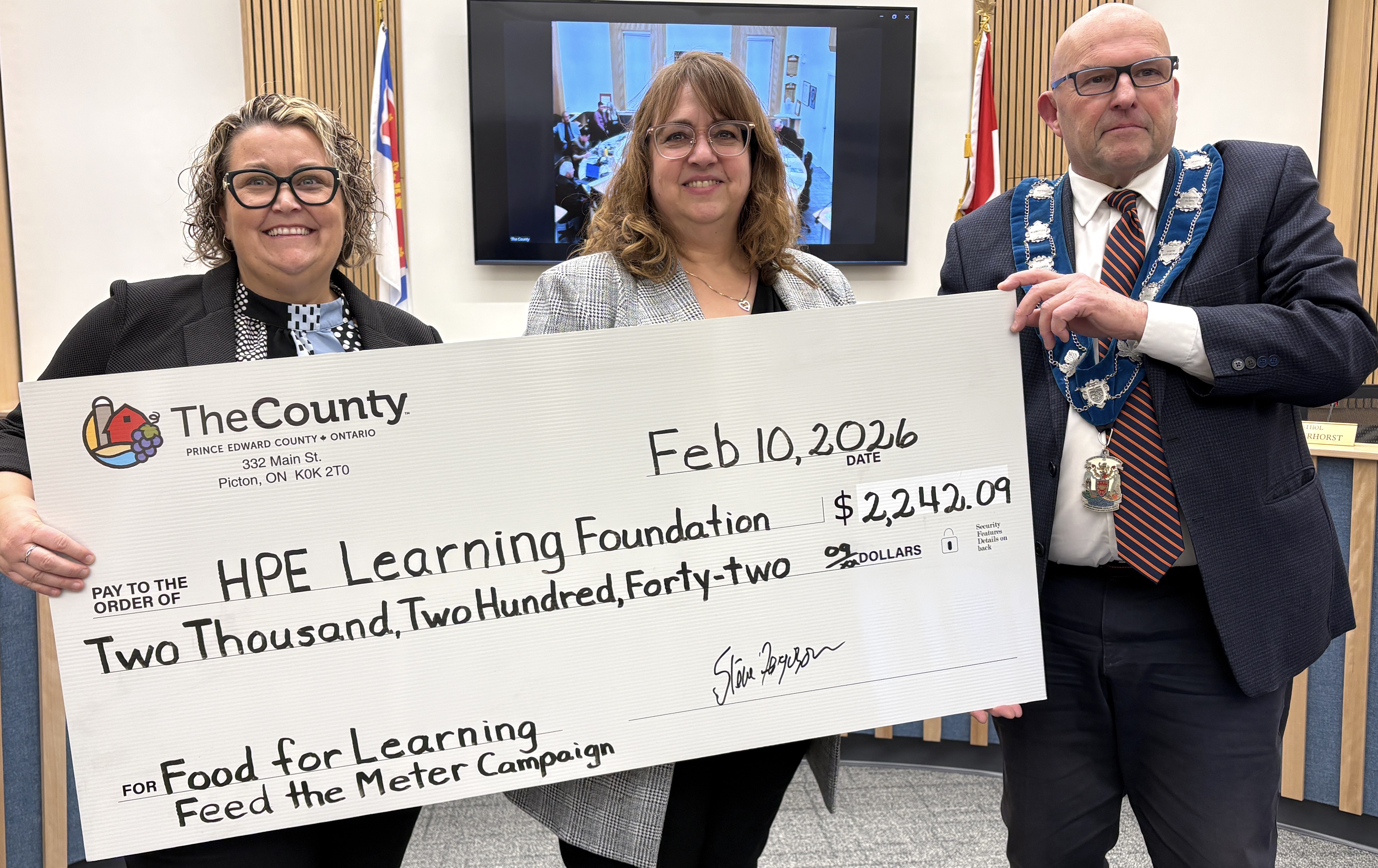 <p>From left: Jenn Barrett and Kellie Brace of the Hastings Prince Edward Learning Foundation accept the 2025-26 Feed the Meter donation from Mayor Steve Ferguson. (Karen Valihora/Gazette Staff)</p>
