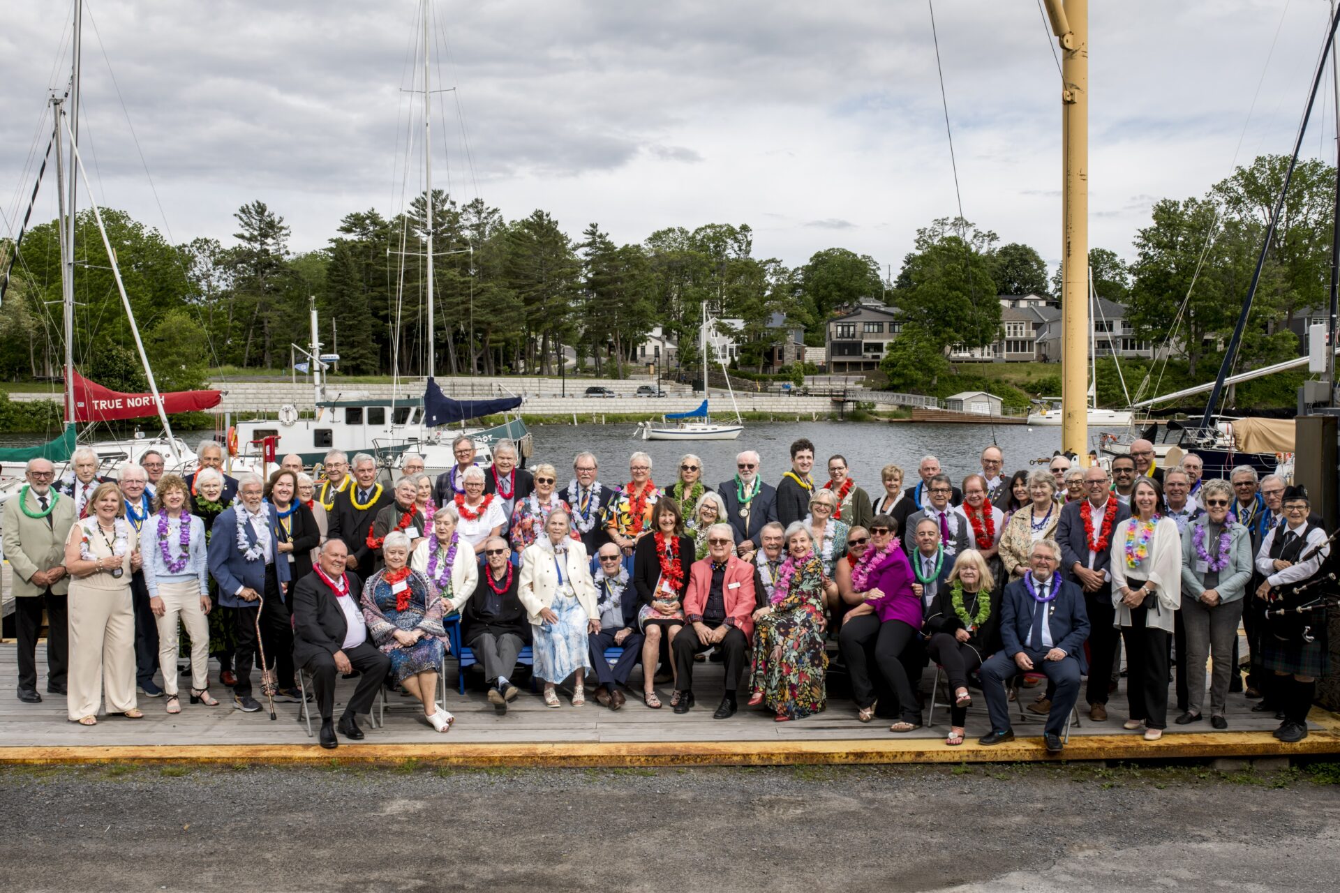 <p>Attendees at the Past Presidents Dinner gather on the dock at the PE Yacht Club before being piped into dinner (Cait Lavoie Photography)</p>
