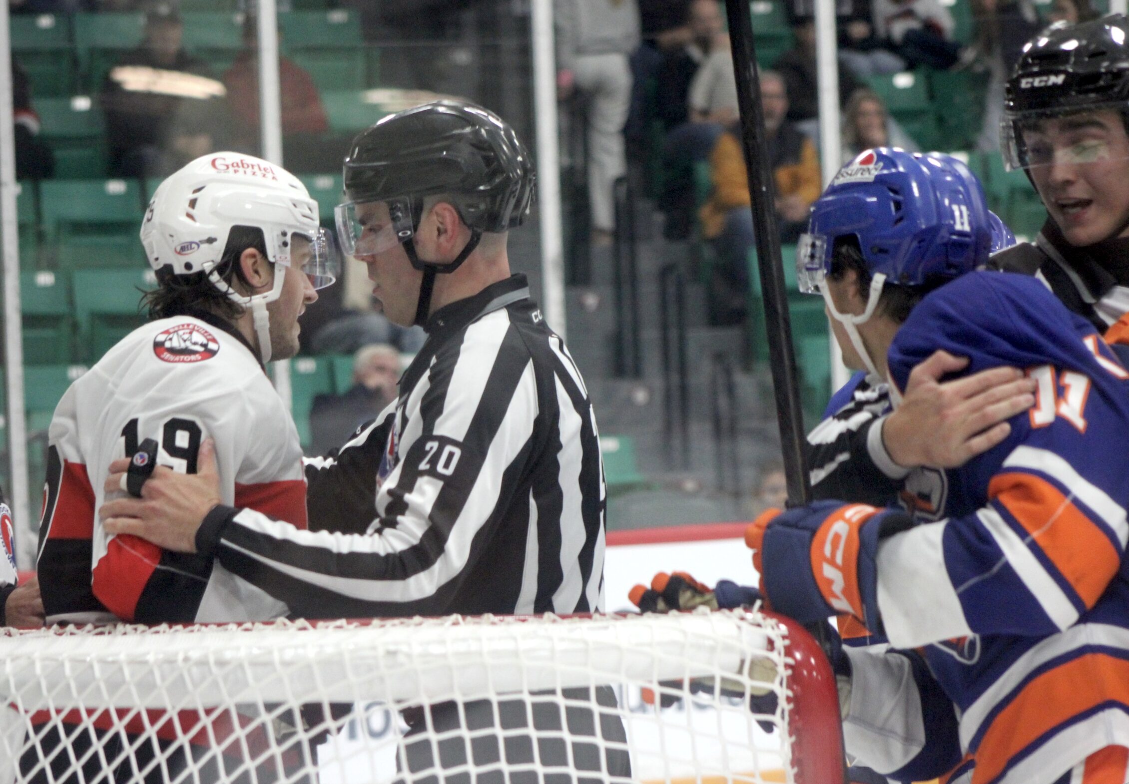 <p>Referees stop Samuel Blais (19) and Daylan Kuefler (11) from renewing hostilities during the Belleville Senators 5-2 loss to the Hamilton Hammers on Friday, October 2. (Photo by Josh Thomas/Gazette Staff) </p>
