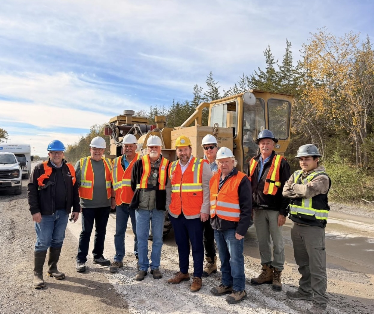 <p>Mayor Steve Ferguson, Coun. John Hirsch, Coun. Phil St. Jean, Coun. Bill Roberts, MPP Tyler Alsopp, Coun. Sam Grosso Former Mayor Robert Quaiff and Coun. Brad Nieman pose in front of the Rubblizer with Tomlinson Staff. (Photo by Mark Kerr) </p>

